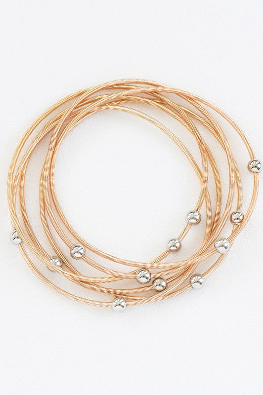 Set de pulseras doradas
