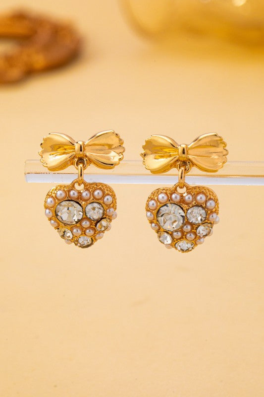 Pantallas doradas de lazo y corazón con cristales y perlas de imitación