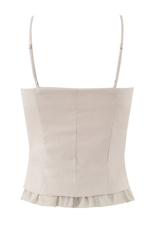 Espalda de la blusa beige de tirantes